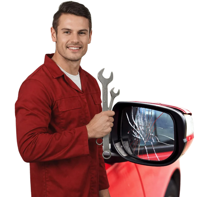 Technician standing next to a cracked car side view mirror ready for glass replacement in Surrey.