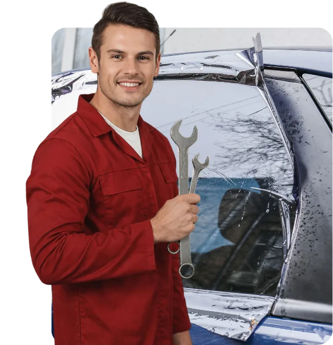 Expert Auto Glass technician applying protective window film to a car side window in Surrey, BC.